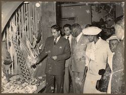 President Tubman and his family examine textiles on a tour