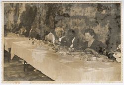 Dignitaries seated at a formal meal in or near Toledo, Spain