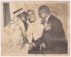 President William V. S. Tubman shakes hands with a dignitary