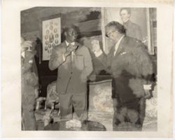 President William V. S. Tubman toasts and drinks with guests