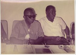 President Tubman and President Magloire sitting at conference table during Sinoe county visit