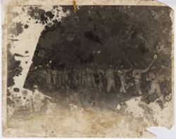 Men in uniform march with torches