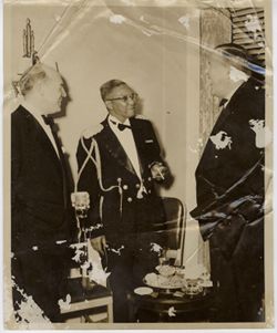 Military officials converse at a reception