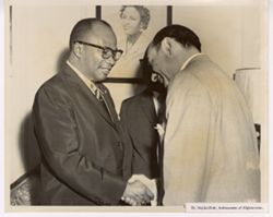Dr. Najib-Ullah, Ambassador of Afghanistan shakes hands with another