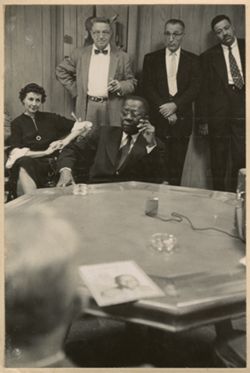 President William V. S. Tubman sits during a press conference with others around him