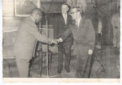 President William V. S. Tubman shakes hands with dignitary during an event