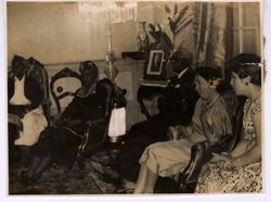 Dignitaries seated in a living room