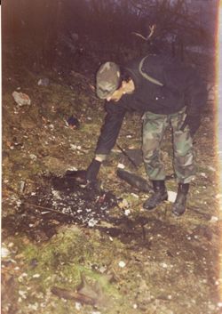 Unidentified Soldier Checking Campfire