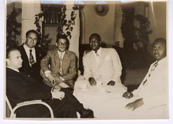 Dignitaries seated at small table