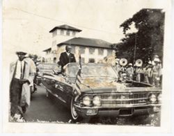 President William V. S. Tubman in back of car in parade