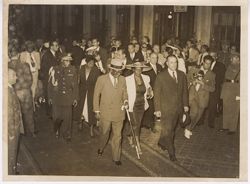 President Tubman carries his cane as crowd falls in behind