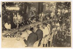 Guests seated at table for formal dinner
