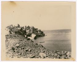 Steps lead into a body of water surrounded by quarried stones