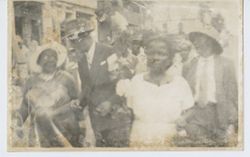 Crowd walking down street
