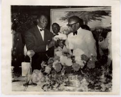 President William V. S. Tubman stands and toasts with S√©kou Tour√© and other guests at head table of reception