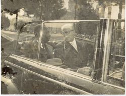 President William V. S. Tubman sits with official in back of car