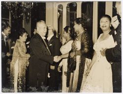 Mrs. Tubman and Mrs. Tolbert shake hands with dignitaries