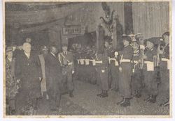 President Tubman pauses to examine German standard bearer