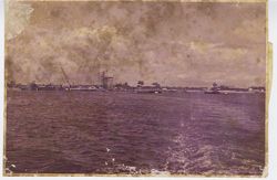 Coastal line spotted with boats and equipment in harbor