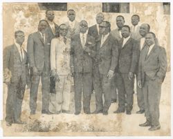 President Tubman and William S. (Shad) Tubman (2nd in the top row)  poses with a group of men for a portrait