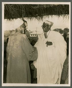 President William V. S. Tubman in traditional attire is greeted