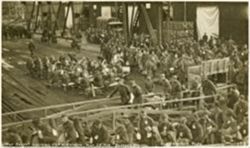 Litter Cases being loaded on USS Wilhelmina along Garonne River in Bassens, France