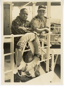 Men pose on the Australian Galaxy ship, New York, NY