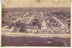 Ariel view of a sandy coastline and town