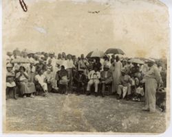 President William V. S. Tubman seated with guests outdoors
