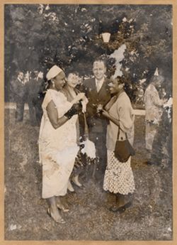 Guests converse at an outdoor reception