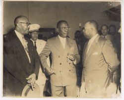 President William V. S. Tubman and Ambassador Brewer talk to dignitary