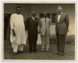 President William V. S. Tubman and three others stand together for a group photograph