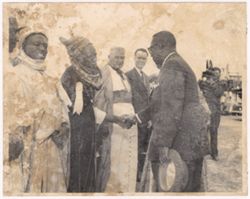 President William V. S. Tubman shakes hands with dignitaries