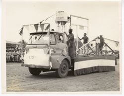 Truck turned into a float driving druing a celebration parade