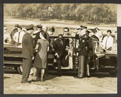 President William V. S. Tubman getting out of car with military personnel standing by