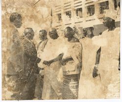 President Tubman greets group in ceremonial outfits