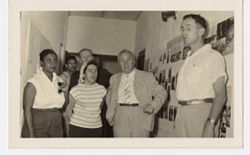 Mrs. Antoinette Tubman and group stand in hall