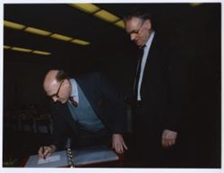 Ambassador Armitage signs book