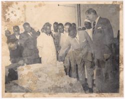 President William V. S. Tubman examines fabric