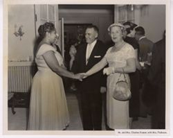 Mr. and Mrs. Charles Kramer shake hands with Mrs. Padmore
