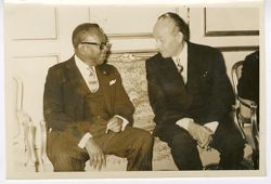 President William V. S. Tubman talks with dignitary during diplomatic meeting