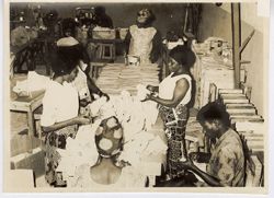 Workers making shoes at a factory