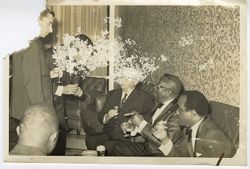 President William V. S. Tubman seated with guest for drinks during a reception