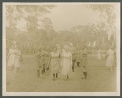 Mrs. Antoinette Tubman walks with woman during event