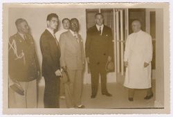 President Tubman stands with dignitaries in a Spanish medical facility