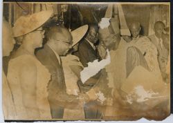 President Tubman, Mrs. Tubman and Vice President Tolbert shake hands with dignitaries in a receiving line