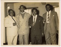 Four unidentified men pose for portrait