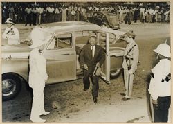 President William V. S. Tubman exits car with large crowd in background