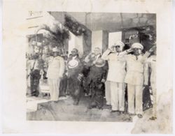 President Tubman and military officials stand at attention