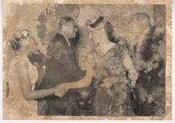 Guests shake hands at a party